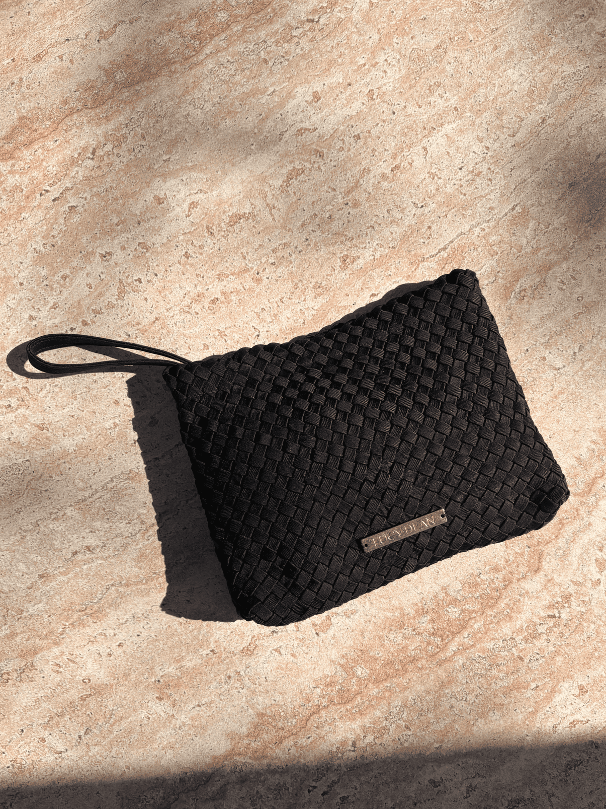 Lucy Dean clutch black flatlay