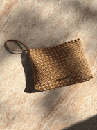 Lucy Dean clutch gold on table