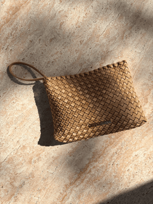 Lucy Dean clutch gold on table